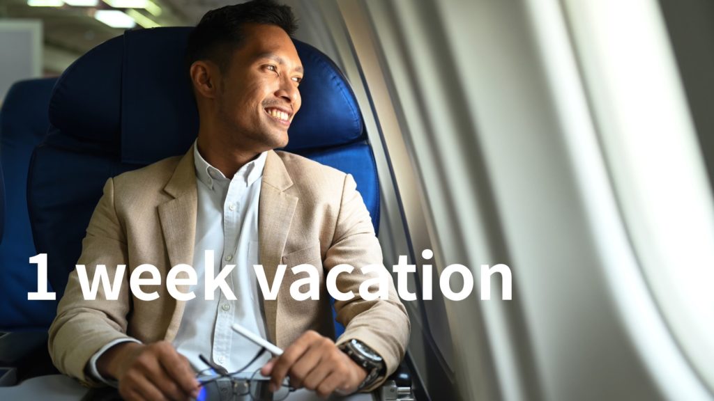 筋トレは1 週間くらい休んでも大丈夫。休み中にバカンスで飛行機に乗る男性。